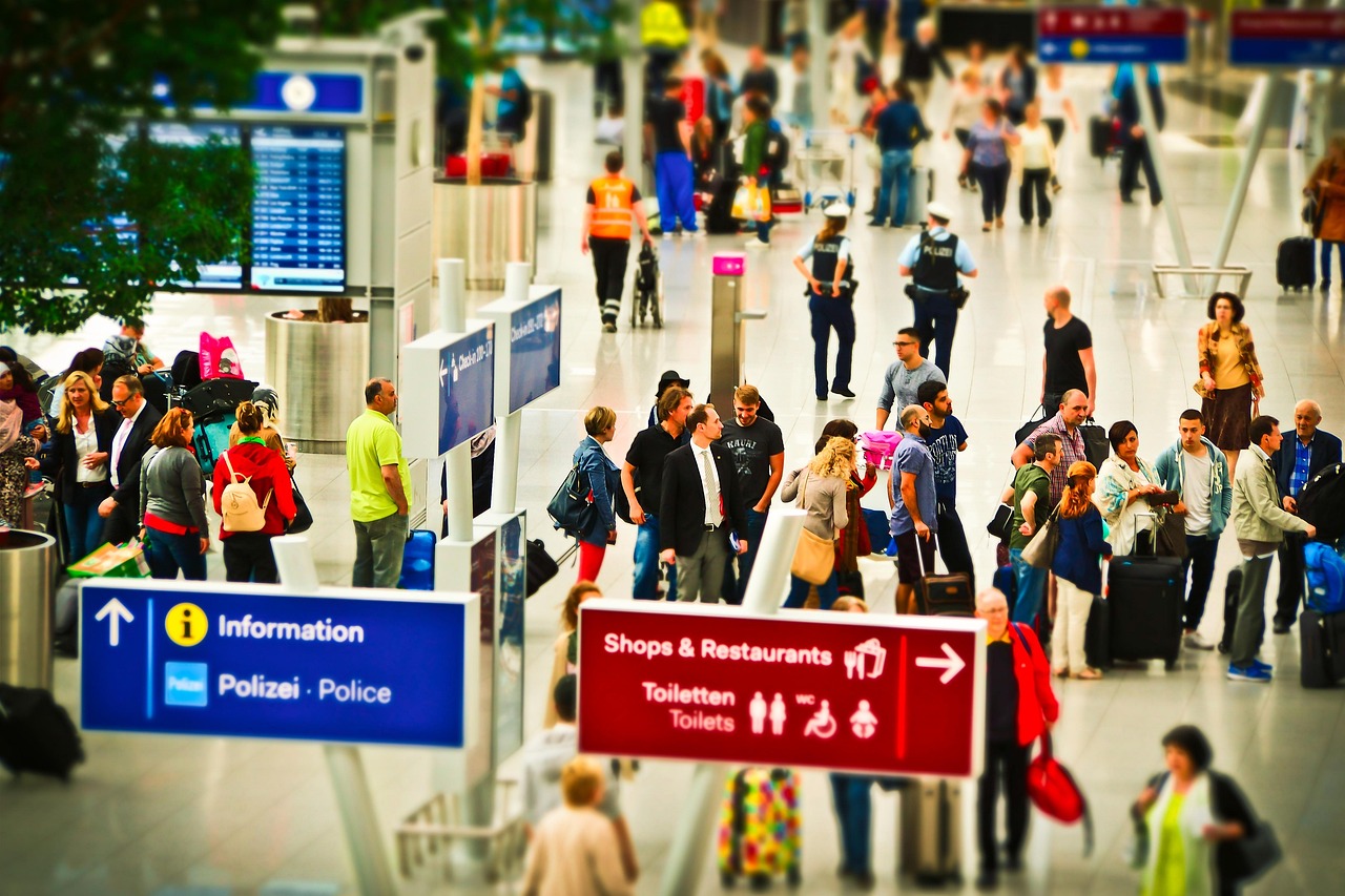 Passengers queuing at BER Airport check-in after cyberattack disruption
