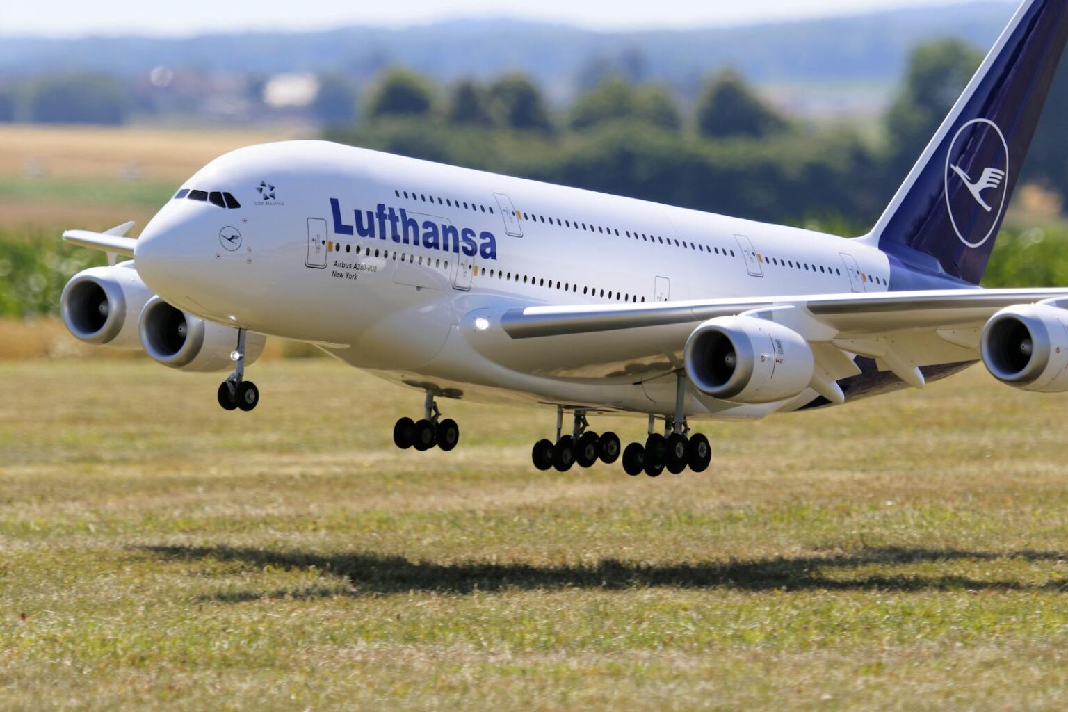 Lufthansa airplane on runway at Munich airport with cloudy sky