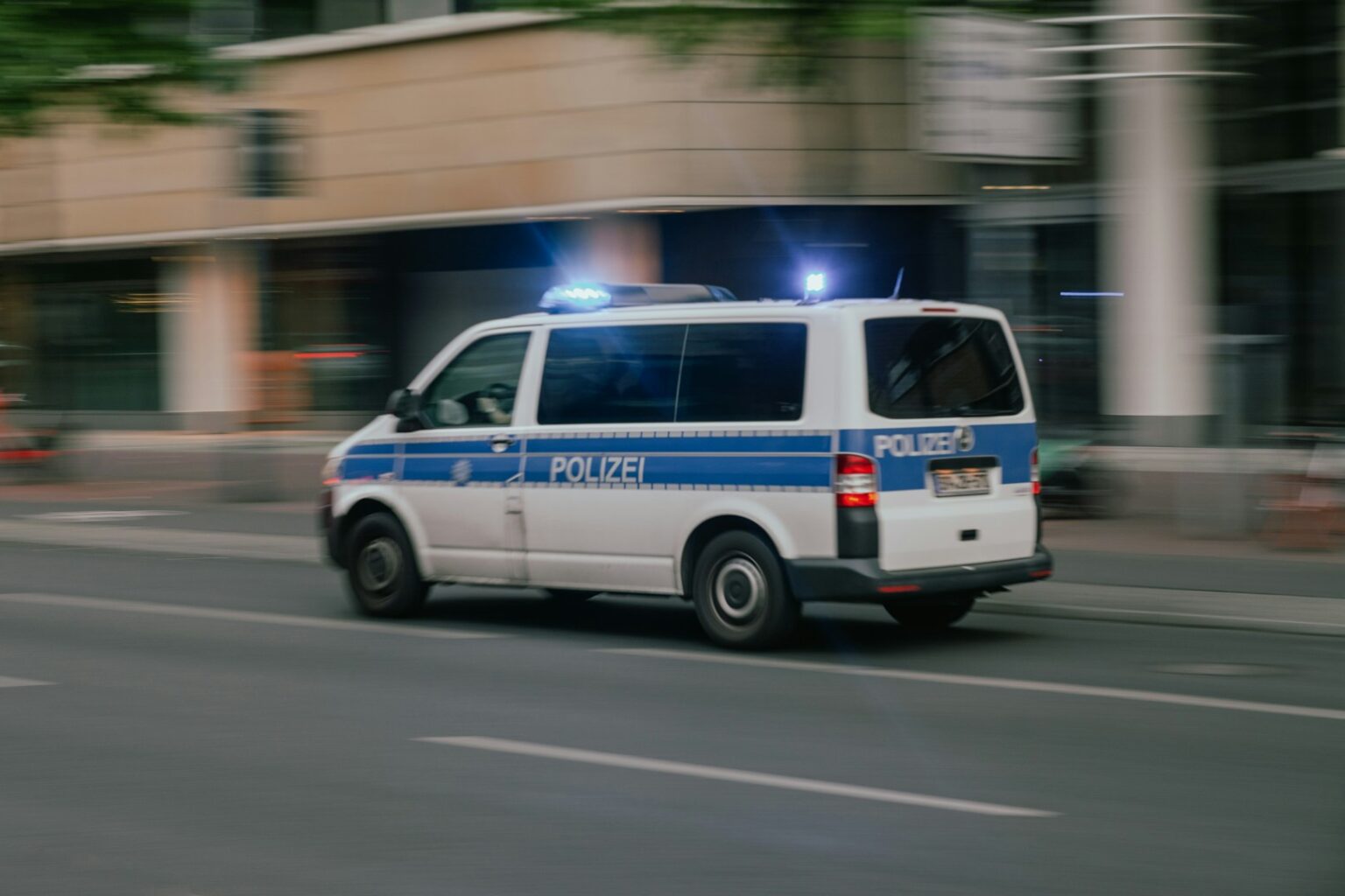 Munich police car near Oktoberfest grounds at night