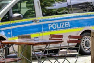 Police vehicle near Oktoberfest grounds in Munich following Uber harassment case