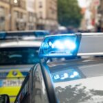 Munich police car parked near Oktoberfest exit at night