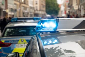 Munich police car parked near Oktoberfest exit at night