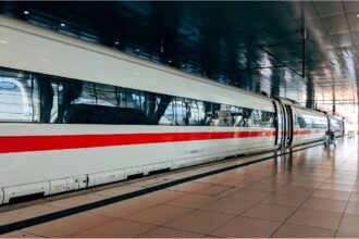 ICE train leaving Munich central station after Deutsche Bahn timetable change