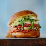 Plant-based burger with EU flag symbolizing new EU rules on meat alternative naming