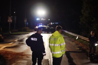 Police and rescue teams at the scene of a fatal car crash near Scharnebeck, Lower Saxony