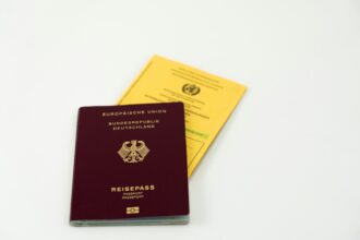 German passport and fake language certificates symbolizing citizenship fraud