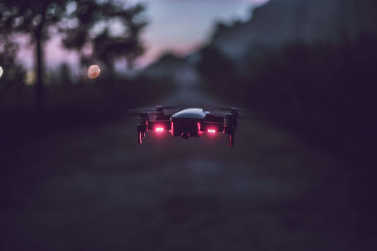 Drone flying at night over industrial facility in Germany