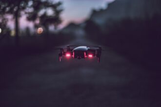 Drone flying at night over industrial facility in Germany