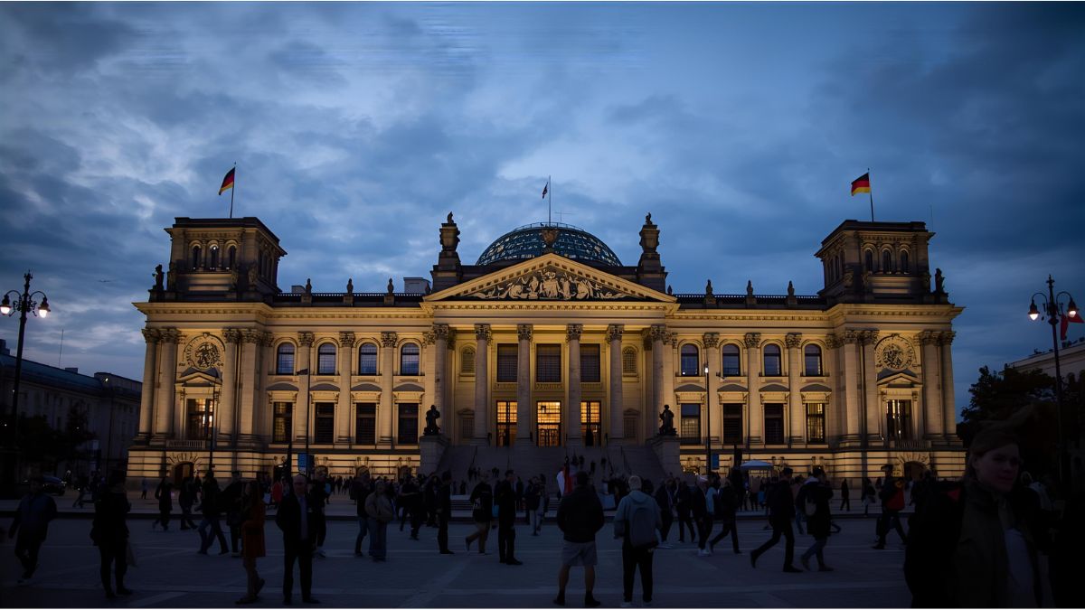 German and EU flags waving in front of the parliament building