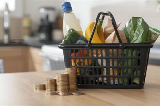 Shopping basket and euro coins symbolizing rising cost of living in Germany