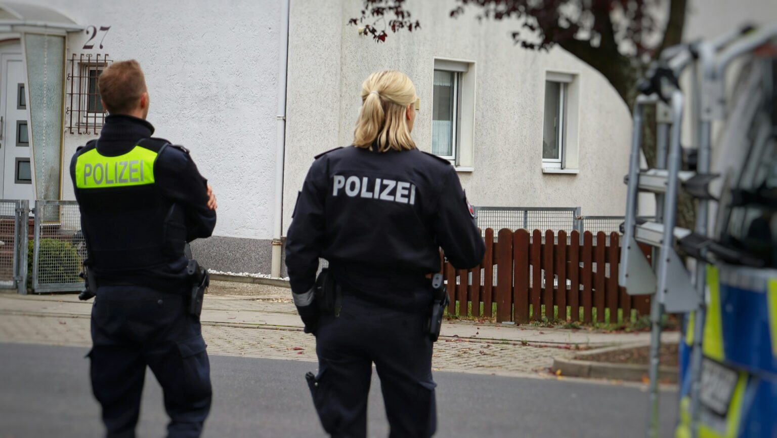 Police vehicles outside a residential building in Herdecke after knife attack on mayor