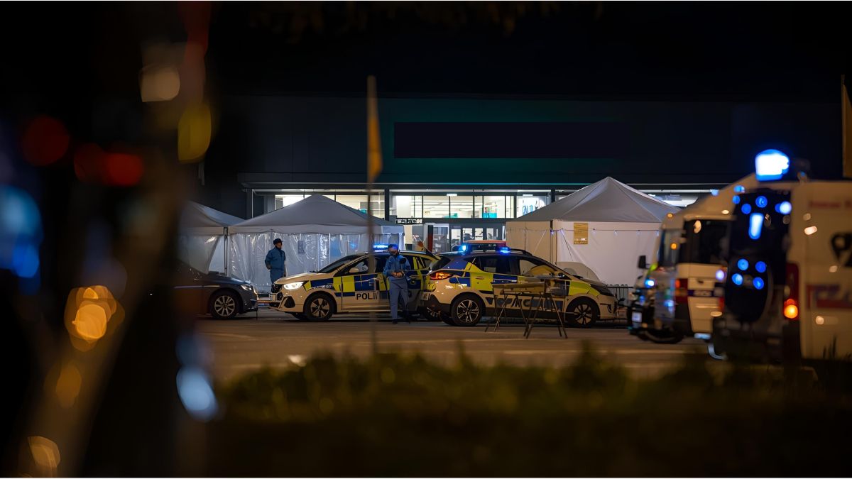 Police vehicles outside a supermarket in Lemgo after a fatal knife attack