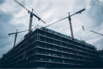 School under renovation with construction cranes in Munich’s Neuhausen district