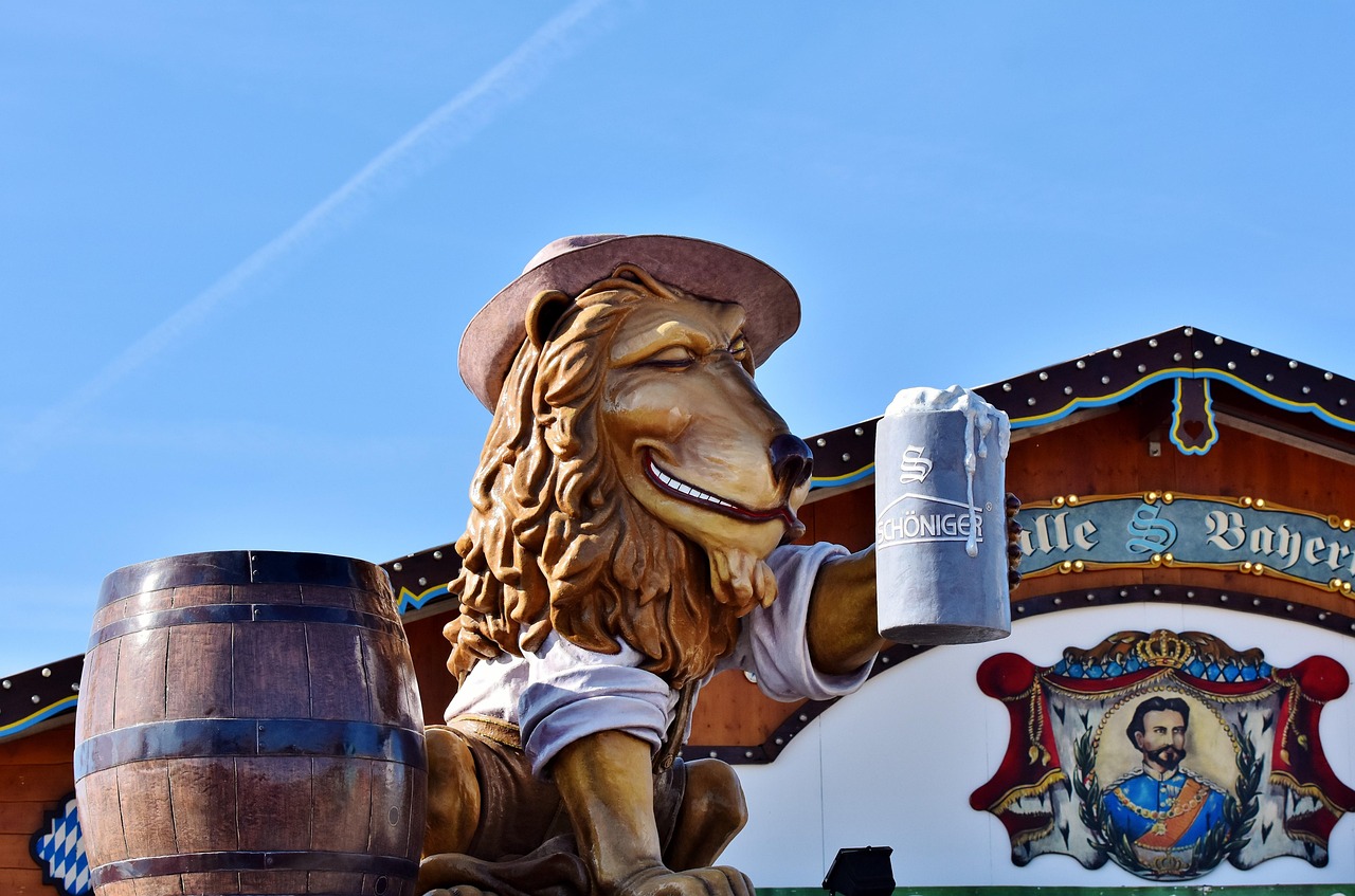 Visitors at Munich Oktoberfest holding soft drinks inside a beer tent
