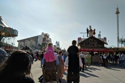 Crowds enjoy the 190th Munich Oktoberfest with tents and beer mugs visible on the Theresienwiese fairground