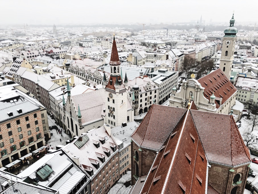 Light snowfall covering fields and low hills during an early winter cold spell in Germany.