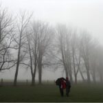 People walking through foggy streets in Germany as temperatures drop sharply