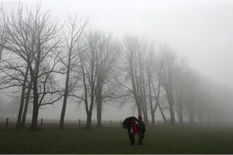 People walking through foggy streets in Germany as temperatures drop sharply