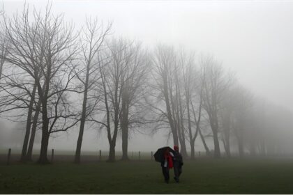 People walking through foggy streets in Germany as temperatures drop sharply