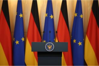 German government podium symbolizing discussions on Syria deportation policy