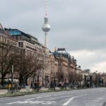 Aerial view of a busy German city road with cars and pedestrians highlighting traffic density.