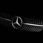 Mercedes-Benz cars displayed in a showroom, representing the brand’s shift away from a luxury-only strategy.