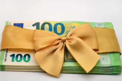 Employees in Germany reviewing payroll documents related to Christmas bonus payments.